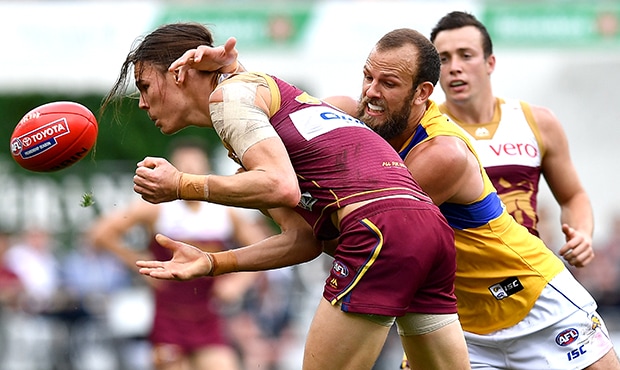 AFL 2018 Round 23 - Brisbane v West Coast BRISBANE, AUSTRALIA - AUGUST 26: Eric Hipwood of the Lions is pressured by the defence of Will Schofield of the Eagles during the round 23 AFL match between the Brisbane Lions and the West Coast Eagles at The Gabba on August 26, 2018 in Brisbane, Australia. (Photo by Bradley Kanaris/Getty Images/AFL Media)